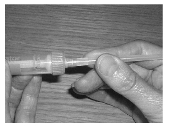 RPush the extension tube on the syringe nozzle